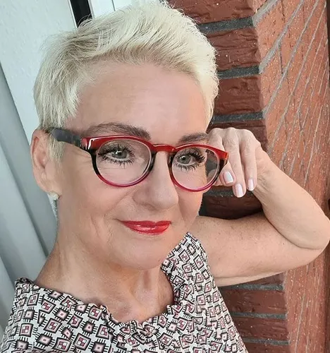 Try on this stylish short blonde hairstyle, accessorized with red-framed glasses, perfect for adding a modern twist to your look.