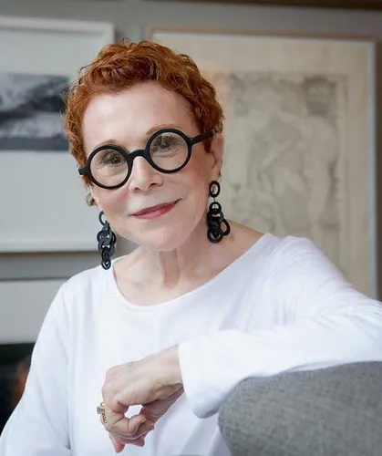 Try on a vibrant short, curly redhead hairstyle with neatly sculpted curls, offering a lively and energetic appearance.