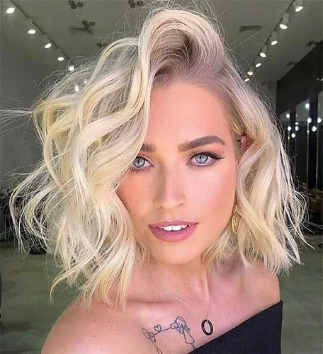 Try on a wavy blonde hairstyle enhancing a chic and trendy look.