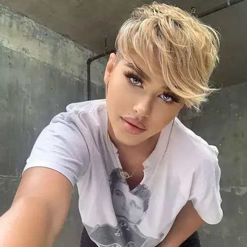 Try on a short, wavy blonde hairstyle with choppy layers and soft bangs