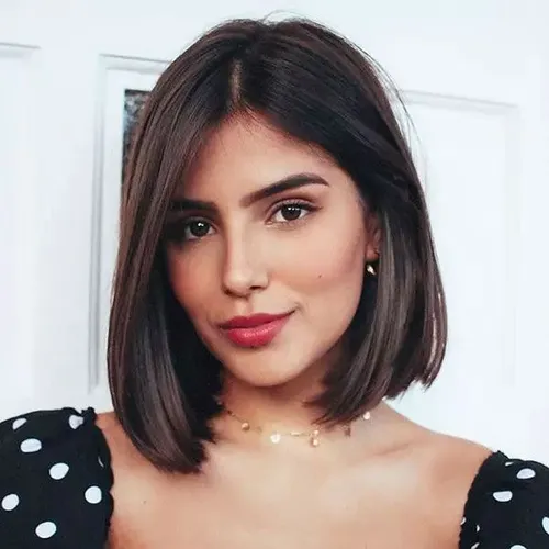 Try on this sleek bob cut hairstyle, neatly cut at the jawline with a smooth and straight texture, enhanced by a subtle brown color.