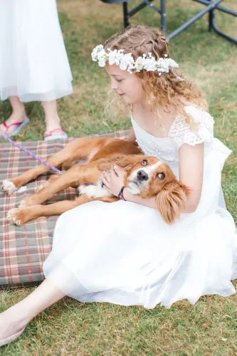 Try on this hairstyle featuring curly hair with a partial braid, enhanced with a delicate floral headpiece