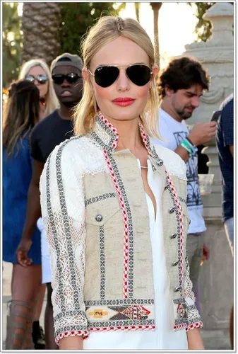 Try on a casual chic hairstyle with blonde, long, wavy hair tied back lightly, suitable for outdoor events.