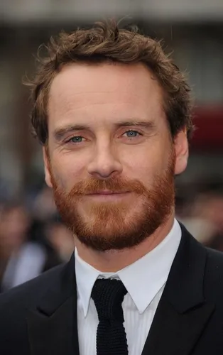 Try on a short wavy hairstyle with a full beard.