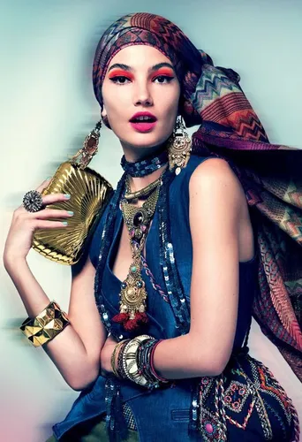 Try on a vibrant and colorful headscarf, styled in a bohemian fashion with intricate patterns and a flowing tail