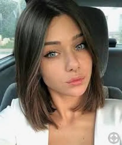 Try on this sleek bob cut with a slight wave, enhancing a fresh and modern look.