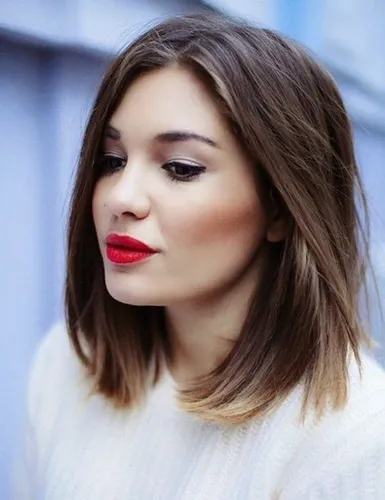 Try on this chic medium-length brown straight hairstyle with a subtle side part, perfect for a sleek, modern look.
