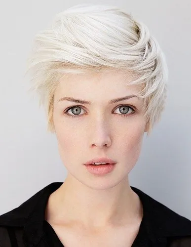Try on a short, messy hairstyle with white blonde hair color and textured layers.
