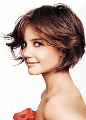 Try on this stylish short layered hairstyle with soft, feathery layers that elegantly frame the face.