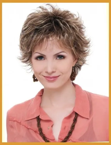 Try on this short, layered, and textured hairstyle with subtle blonde highlights.