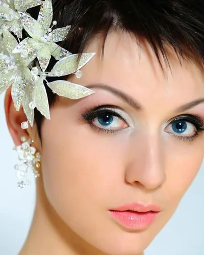 Try on this sleek pixie cut hairstyle that offers a sharp and stylish look.