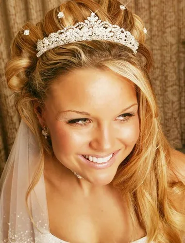 Try on a hairstyle featuring a half-up-half-down style with curls, adorned with a sparkling tiara.