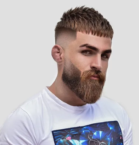 Try on a hairstyle with a buzz cut and a full beard, combining sharp lines and textured top with a neatly groomed, thick beard.