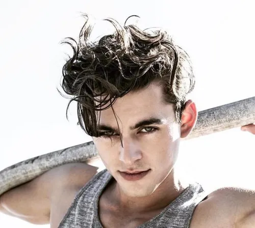 Try on a wavy, voluminous hairstyle with pronounced waves adding texture.