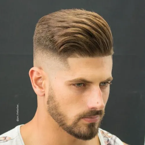 Try on this trendy hairstyle featuring a slicked back look with a neat undercut, making it a stylish choice for a clean and modern appearance.