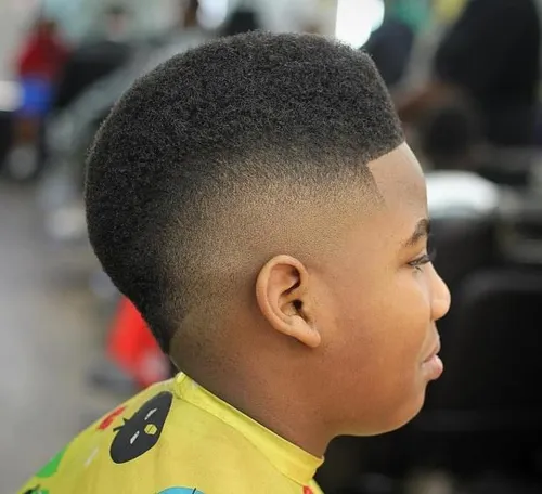 Try on a high-top fade hairstyle with closely shaved sides.