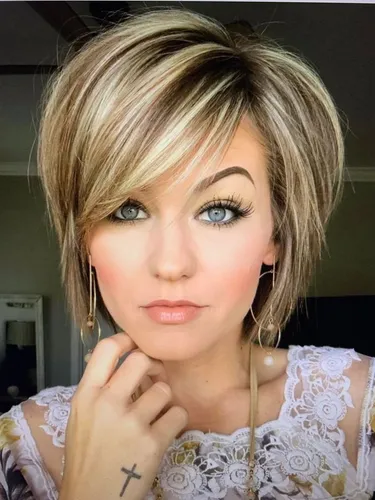 Try on this short, layered cut with blonde highlights hairstyle, featuring a modern and stylish appearance suitable for various occasions.