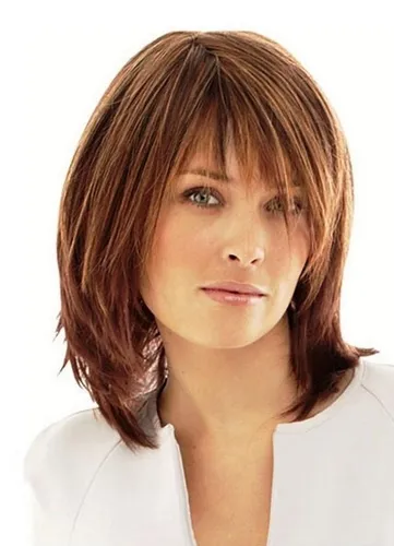 Try on this medium-length layered hairstyle with bangs, featuring subtly highlighted strands adding dimension and style.