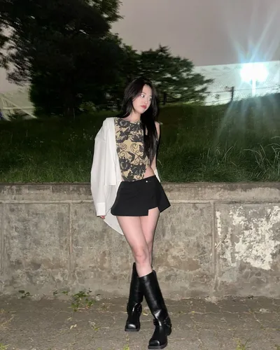 Try on this sleek, straight long hairstyle that cascades down past the shoulders, giving a chic and elegant look in a night-time outdoor setting.
