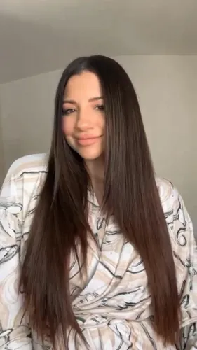 Try on this sleek and long straight hairstyle, where the hair is evenly cut and flows smoothly down past the shoulders, providing a classic and elegant look.