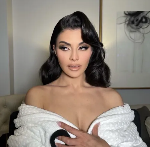 Try on this voluminous curled hairstyle, featuring large soft curls that frame the face beautifully.