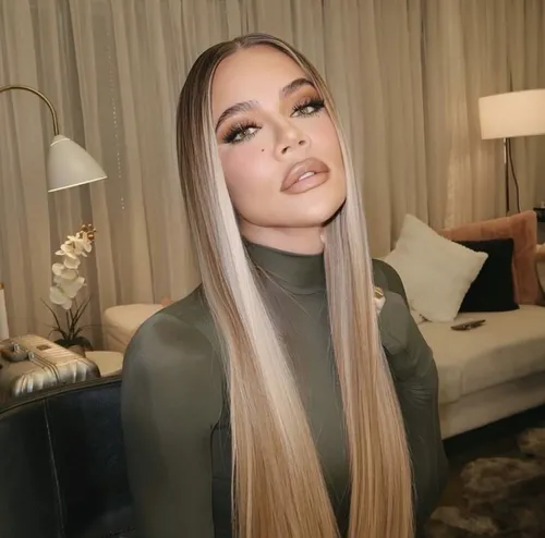 Try on this sleek long straight hairstyle with a subtle ombre transition from dark roots to light tips.