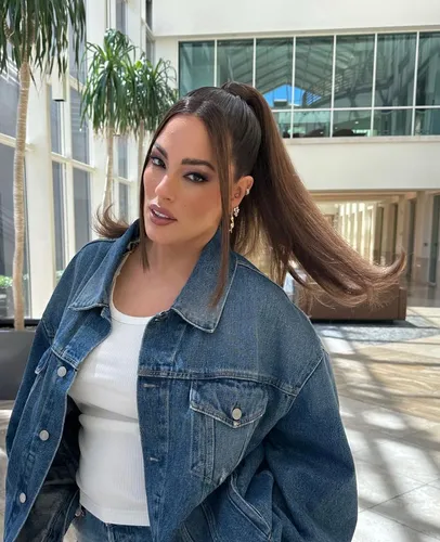 Try on a sleek high ponytail hairstyle with soft brown highlights, complemented by a subtle side sweep adding a touch of elegance.