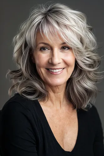 Try on a voluminous, wavy, layered hairstyle in shades of gray and white, exuding an airy and youthful look.