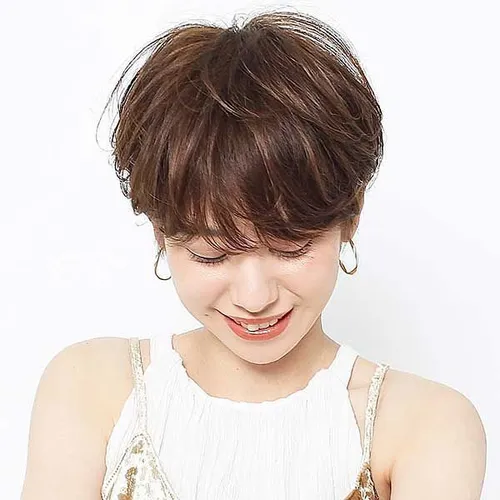 try on this elegant updo hairstyle with soft bangs, styled into a casual twist at the back