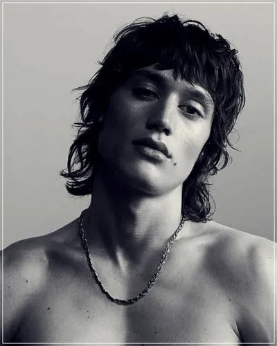 Try on a shaggy hair style with unkempt, layered locks that give a casual and textured appearance.