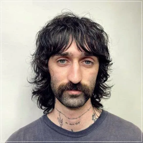 Try on a shaggy, curly hairstyle with shoulder-length layers