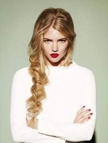 Try on this hairstyle featuring long hair fashioned into an intricate braid.
