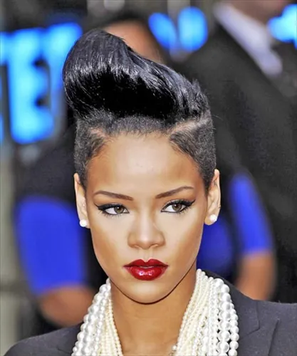try on this sleek updo hairstyle featuring smoothly combed back hair leading into a voluminous, polished pompadour on top