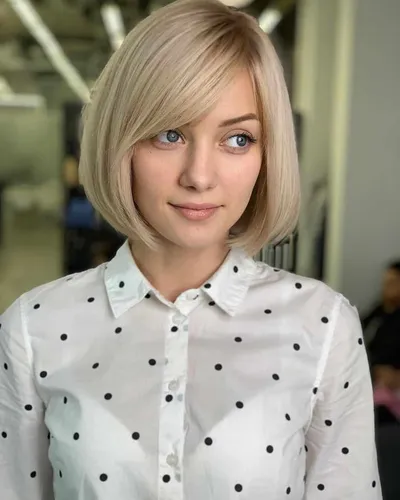 Try on this elegant bob cut hairstyle, featuring smooth, straight hair that gently frames the face, complemented by a subtle side part adding a touch of sophistication.