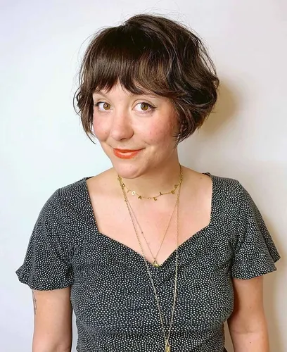 Try on this chic bob haircut with soft bangs, adding a playful yet elegant touch.