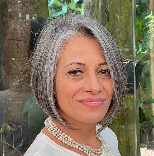 Try on a stylish short gray hairstyle, featuring a neat, face-framing bob cut that elegantly highlights facial features with its smooth and neatly trimmed ends.