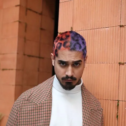 Try on a creative buzz cut hairstyle with sections colored in purple and orange