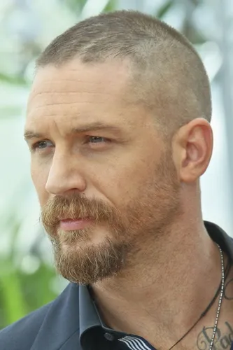 Try on a buzz cut hairstyle, featuring very short hair all around the head, combined with a full, neatly trimmed beard for a rugged appearance.