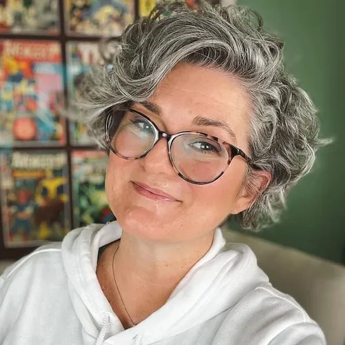Try on a curly, short gray hairstyle, which is elegantly tousled to enhance the texture.
